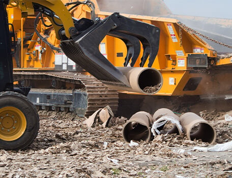 Skid Steer Loader with Grapple Bucket Attachment